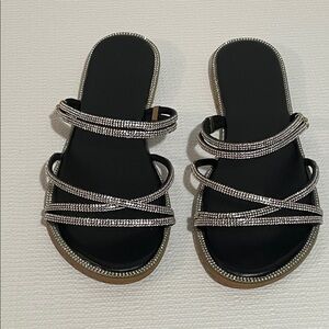 Elegant Black and Silver Women's Flat sandals.